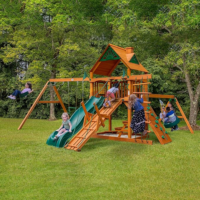 Gorilla Playsets 01-0004-AP Frontier Wood Swing Set with Wood Roof, Tire Swing, Two Belt Swings, Picnic Table, Sandbox, Rock Climbing Wall, Amber